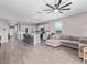 Open-concept living space with hardwood floors, recessed lighting, and a neutral color palette at 36708 N Petra Dr, San Tan Valley, AZ 85143