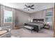 This spacious main bedroom features a ceiling fan, sitting area and a king-size bed at 36708 N Petra Dr, San Tan Valley, AZ 85143