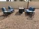 Outdoor seating area with comfortable cushioned chairs, perfect for entertaining at 36765 W Mediterranean Way, Maricopa, AZ 85138