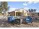 Spacious backyard featuring patio furniture and barbecue, perfect for outdoor entertaining at 36765 W Mediterranean Way, Maricopa, AZ 85138