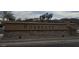 The stone-based Sorrento community sign is beautifully designed with contrasting stone and decorative gate at 36765 W Mediterranean Way, Maricopa, AZ 85138