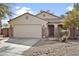 Charming single-story home with a two-car garage, tile roof, and low-maintenance desert landscaping at 36765 W Mediterranean Way, Maricopa, AZ 85138