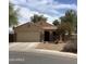 Charming single-story home features a tile roof and low-maintenance desert landscaping at 36765 W Mediterranean Way, Maricopa, AZ 85138