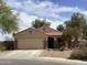 Charming single-story home with tile roof, attached garage, and low-maintenance desert landscaping at 36765 W Mediterranean Way, Maricopa, AZ 85138