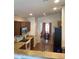Functional kitchen layout with modern appliances, ample counter space and stainless steel refrigerator at 36765 W Mediterranean Way, Maricopa, AZ 85138