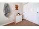 Bedroom with white closet doors and a decorative wood carving on the wall at 3682 S Rosemary Dr, Chandler, AZ 85248