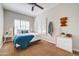 Cozy bedroom featuring neutral walls, ceiling fan and white shutters that enhance the natural light at 3682 S Rosemary Dr, Chandler, AZ 85248
