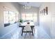 Bright dining room with large windows, modern lighting, and a stylish dining set at 3682 S Rosemary Dr, Chandler, AZ 85248