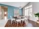 Inviting dining room with a view to the living room features stylish lighting and sleek floors at 3682 S Rosemary Dr, Chandler, AZ 85248
