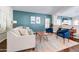 Bright living room featuring stylish decor, high ceilings, plantation shutters, and seamless transition to other rooms at 3682 S Rosemary Dr, Chandler, AZ 85248