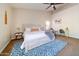 Inviting main bedroom includes a writing desk, vaulted ceiling, and a cozy rocking chair at 3682 S Rosemary Dr, Chandler, AZ 85248