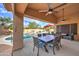 Extended covered patio, ideal for dining, views the pool, spa, and backyard landscaping at 3682 S Rosemary Dr, Chandler, AZ 85248