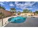 Refreshing swimming pool and spa surrounded by lush desert landscaping and clear blue sky at 3682 S Rosemary Dr, Chandler, AZ 85248