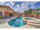 Inviting backyard pool and spa surrounded by desert landscaping perfect for relaxing and entertaining under the sun at 3682 S Rosemary Dr, Chandler, AZ 85248