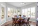 Bright dining area with plantation shutters, and a round table with seating for four at 3721 E Colonial E Dr, Chandler, AZ 85249