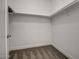 Walk-in closet with carpeted floors and metal shelving at 38538 W San Juan Ave, Tonopah, AZ 85354