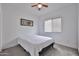 Cozy bedroom with carpet floors and a bed next to a window with blinds at 3925 W Hackamore Dr, Phoenix, AZ 85083