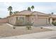 Charming single-story home with a tiled roof, desert landscaping, and an attached two-car garage at 3925 W Hackamore Dr, Phoenix, AZ 85083