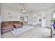 Inviting living room featuring a comfortable sectional sofa, ceiling fan, and stylish decor at 3925 W Hackamore Dr, Phoenix, AZ 85083