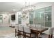 Dining room with a large table, neutral walls, and lots of natural light from the large windows at 4084 E Rawhide St, Gilbert, AZ 85296