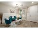 Sitting room with wainscotting, modern furnishings, and an elegant light fixture at 4084 E Rawhide St, Gilbert, AZ 85296