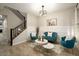 Sitting room with wainscotting, modern furnishings, and an elegant light fixture at 4084 E Rawhide St, Gilbert, AZ 85296