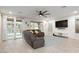 Living room featuring neutral walls, tile floors, recessed lighting, and sliding glass doors to the backyard at 4084 E Rawhide St, Gilbert, AZ 85296