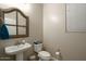 Simple powder room featuring a pedestal sink and window with blinds at 4084 E Rawhide St, Gilbert, AZ 85296