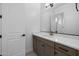 Modern bathroom with white countertop, wood cabinets, and stylish fixtures at 4211 E Desert Vista Trl, Cave Creek, AZ 85331