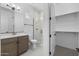 Bathroom featuring a tiled shower with glass door, closet, and vanity at 4211 E Desert Vista Trl, Cave Creek, AZ 85331