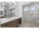 A modern bathroom features sleek lines, marble accents, and a glass enclosed shower at 4211 E Desert Vista Trl, Cave Creek, AZ 85331