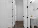 Hallway bathroom featuring hardwood floors and a pedestal sink at 4211 E Desert Vista Trl, Cave Creek, AZ 85331