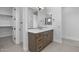 Bright and airy bathroom featuring a vanity with lots of storage and closet access at 4211 E Desert Vista Trl, Cave Creek, AZ 85331