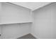 Walk-in closet featuring ample storage and a simple, functional design with metal bars at 4211 E Desert Vista Trl, Cave Creek, AZ 85331