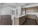 This kitchen features an island with stainless steel appliances and wood floors at 4211 E Desert Vista Trl, Cave Creek, AZ 85331