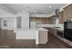 This kitchen features an island, modern appliances, and wood floors at 4211 E Desert Vista Trl, Cave Creek, AZ 85331