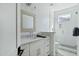 Elegant bathroom featuring a glass-enclosed shower and a decorative mirror at 4507 E Weldon Ave, Phoenix, AZ 85018