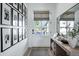 Bright entryway with light wood floors, stylish console table and modern decor at 4507 E Weldon Ave, Phoenix, AZ 85018