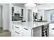 Kitchen island with white countertop and gray cabinets at 4507 E Weldon Ave, Phoenix, AZ 85018