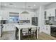 Stylish kitchen featuring white cabinetry, a center island, and stainless appliances at 4507 E Weldon Ave, Phoenix, AZ 85018