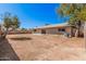 This backyard features desert landscaping, a block wall, patio, and an AC unit at 4533 S Terrace Rd, Tempe, AZ 85282