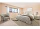 Comfortable bedroom featuring carpet, a large window, and neutral decor at 4533 S Terrace Rd, Tempe, AZ 85282