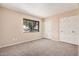 This carpeted bedroom has a closet and window with a view to the outside at 4533 S Terrace Rd, Tempe, AZ 85282