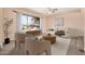 Cozy living room with a large window, ceiling fan, modern furniture and neutral color palette at 4533 S Terrace Rd, Tempe, AZ 85282