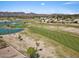 Panoramic aerial view of a golf course community with mountain views and scenic water features at 4538 E Shomi St, Phoenix, AZ 85044
