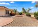 Lovely backyard featuring desert landscaping, mature plantings, and a privacy wall at 4538 E Shomi St, Phoenix, AZ 85044