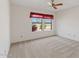 Bedroom features two windows with charming red curtains offering views of the lush outdoor landscape at 4538 E Shomi St, Phoenix, AZ 85044