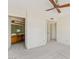 Bright bedroom with ceiling fan providing easy access to the bathroom with vanity at 4538 E Shomi St, Phoenix, AZ 85044