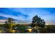 Expansive aerial view captures the property's lush surroundings and city skyline on the horizon at 4743 N 54Th St, Phoenix, AZ 85018