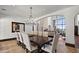 Open dining area with chandelier and seating for ten near the living room at 4743 N 54Th St, Phoenix, AZ 85018